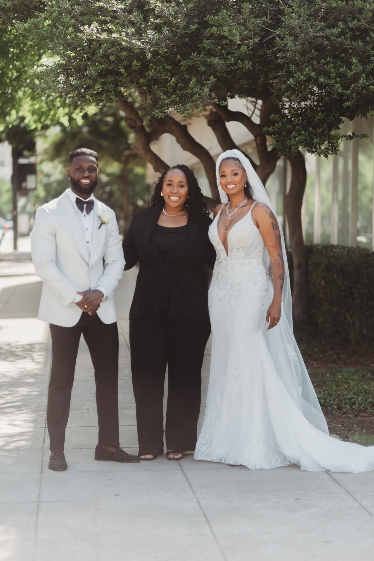 Jennifer Allen with a newly married couple