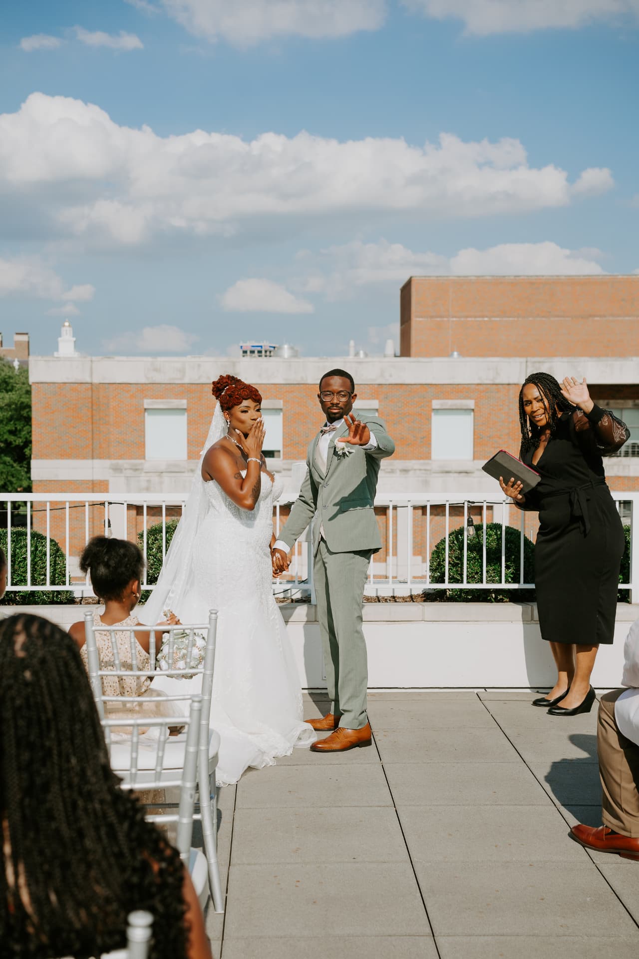 Jennifer Allen officiating an outdoor rooftop wedding ceremony
