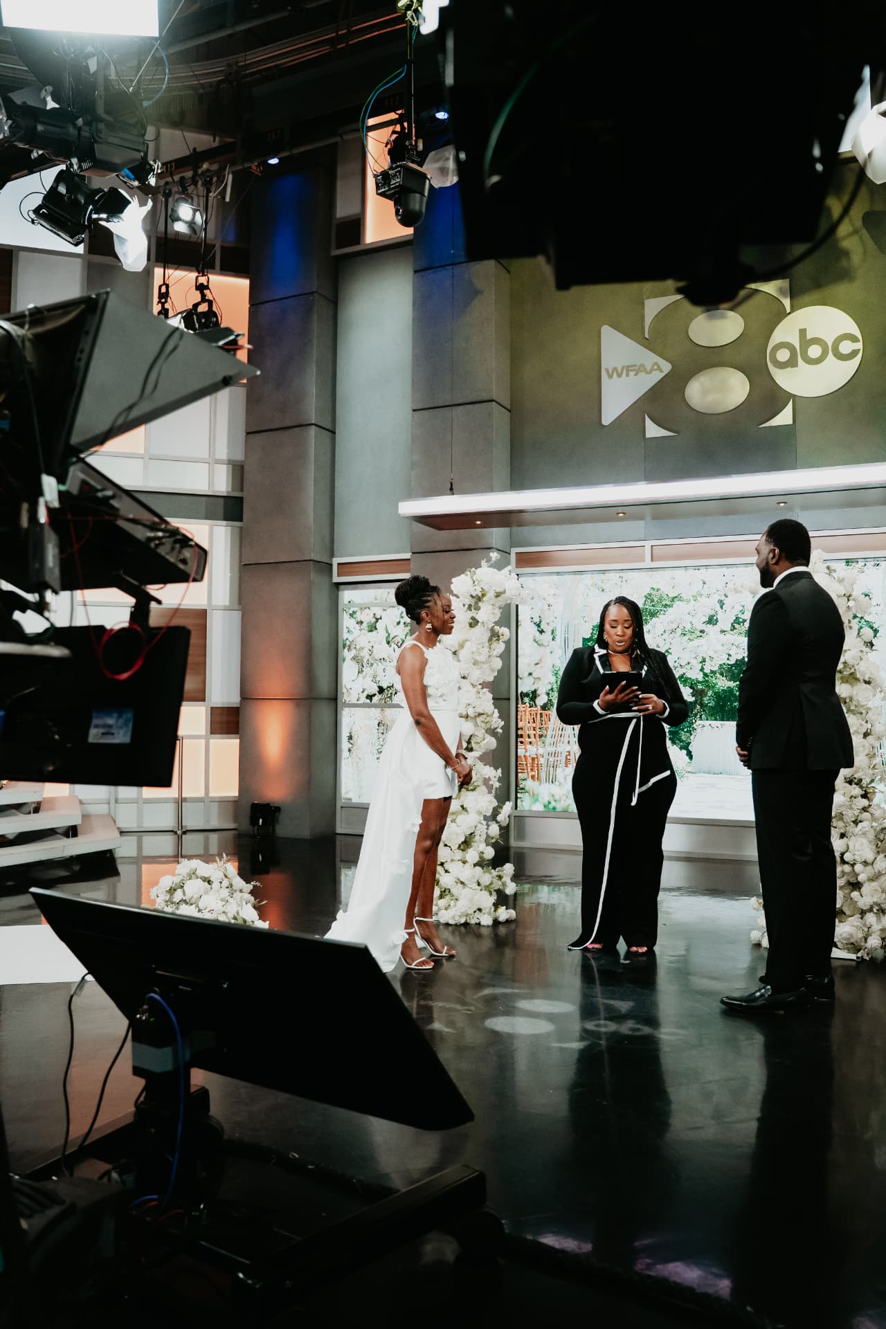 Jennifer Allen officiating a wedding in the WFAA ABC studio